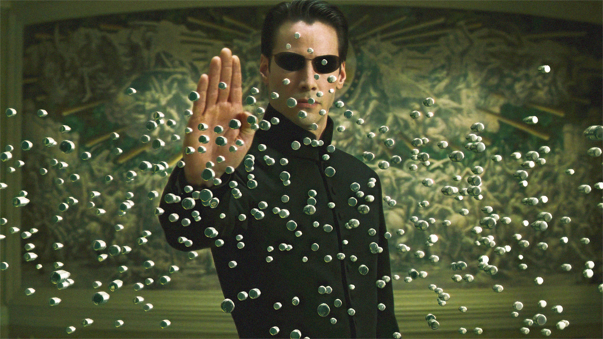 Neo en train d'arrêter les balles qui foncent sur lui dans Matrix