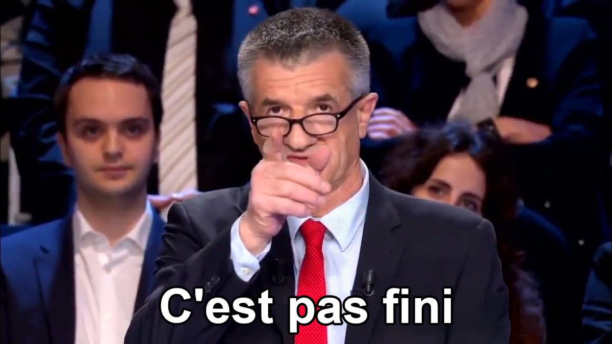 Jean Lassalle pointant le doigt vers la caméra sur un plateau télé, avec la légende C'est pas fini